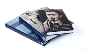 A stack of three private autobiographies produced by LifeBook Memoirs.