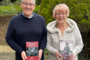 LifeBook authors Bob and Pauline Forster holding their private autobiographies.