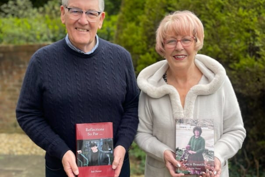 LifeBook authors Bob and Pauline Forster holding their private autobiographies.