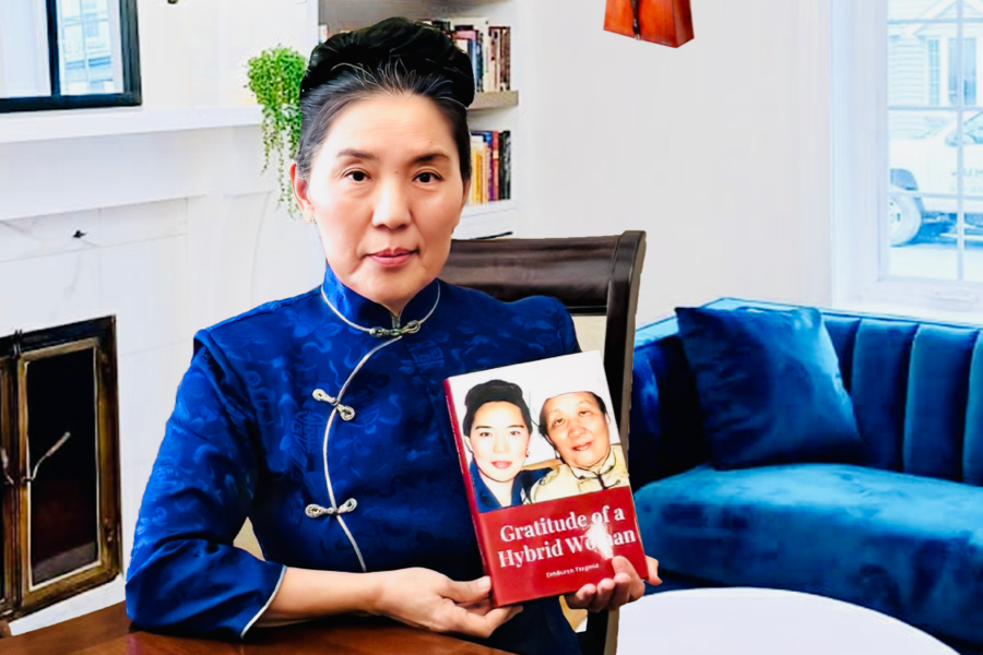 LifeBook author Buren Tsegmid, holding her private autobiography, Gratitude of a Hybrid Woman