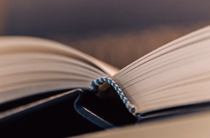 Memoir book opened to lay flat showing the spine