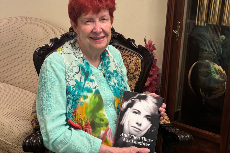 LifeBook author Carol Knox pictured with her private autobiography, And Then There Was Laughter.