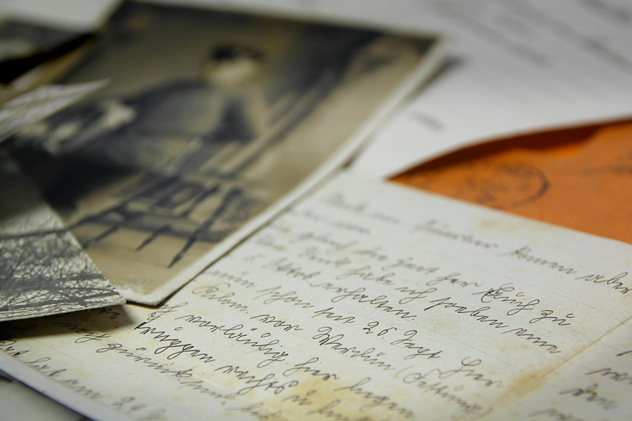 A close-up photo of old letters and photographs.