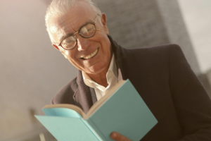 An older man reading a book