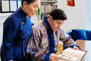 LifeBook author EnhBuren Tsegmid and her son reading her private autobiography